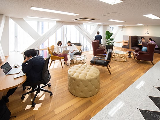 six people working in a spacious Coworking space