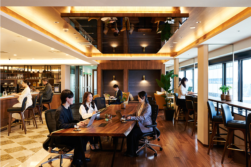 Business clients using Servcorp Osaka Twin 21's coworking space